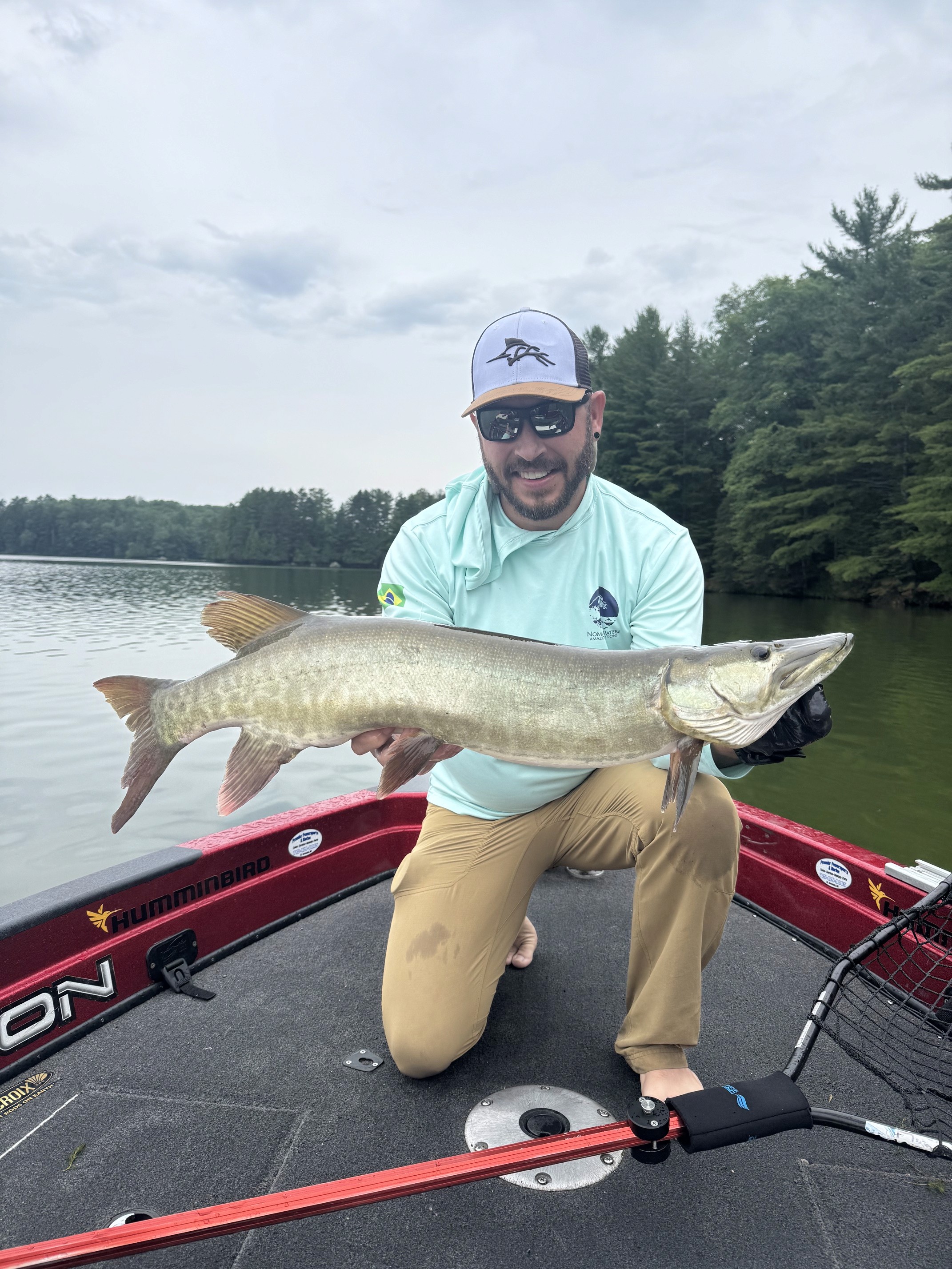 Angler holding a musky during the July 31 guided trip