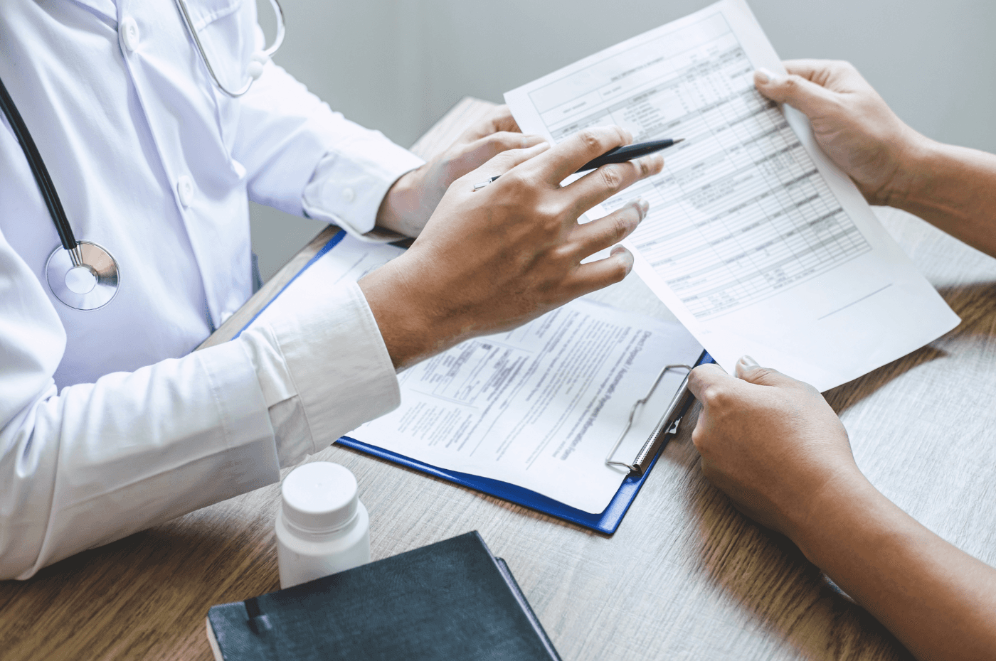 Professional Doctor in White Uniform Gown Coat and Patient