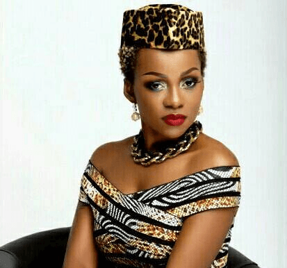 Woman in colorful striped sweater.