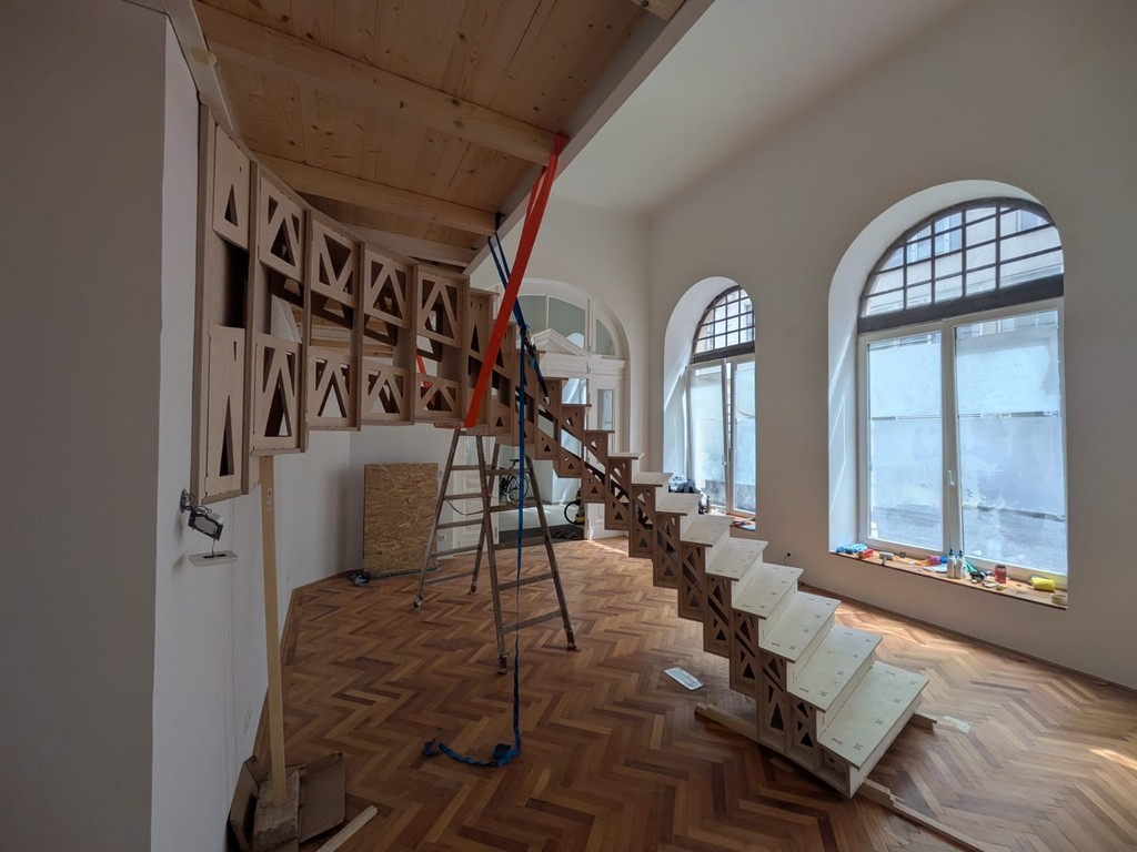 Threshold, the plywood staircase, in its room