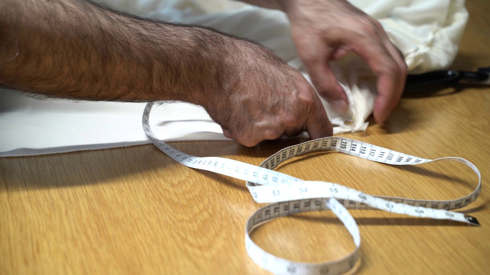 Frame from A Tailors Cut a film by Slate & Shutter
