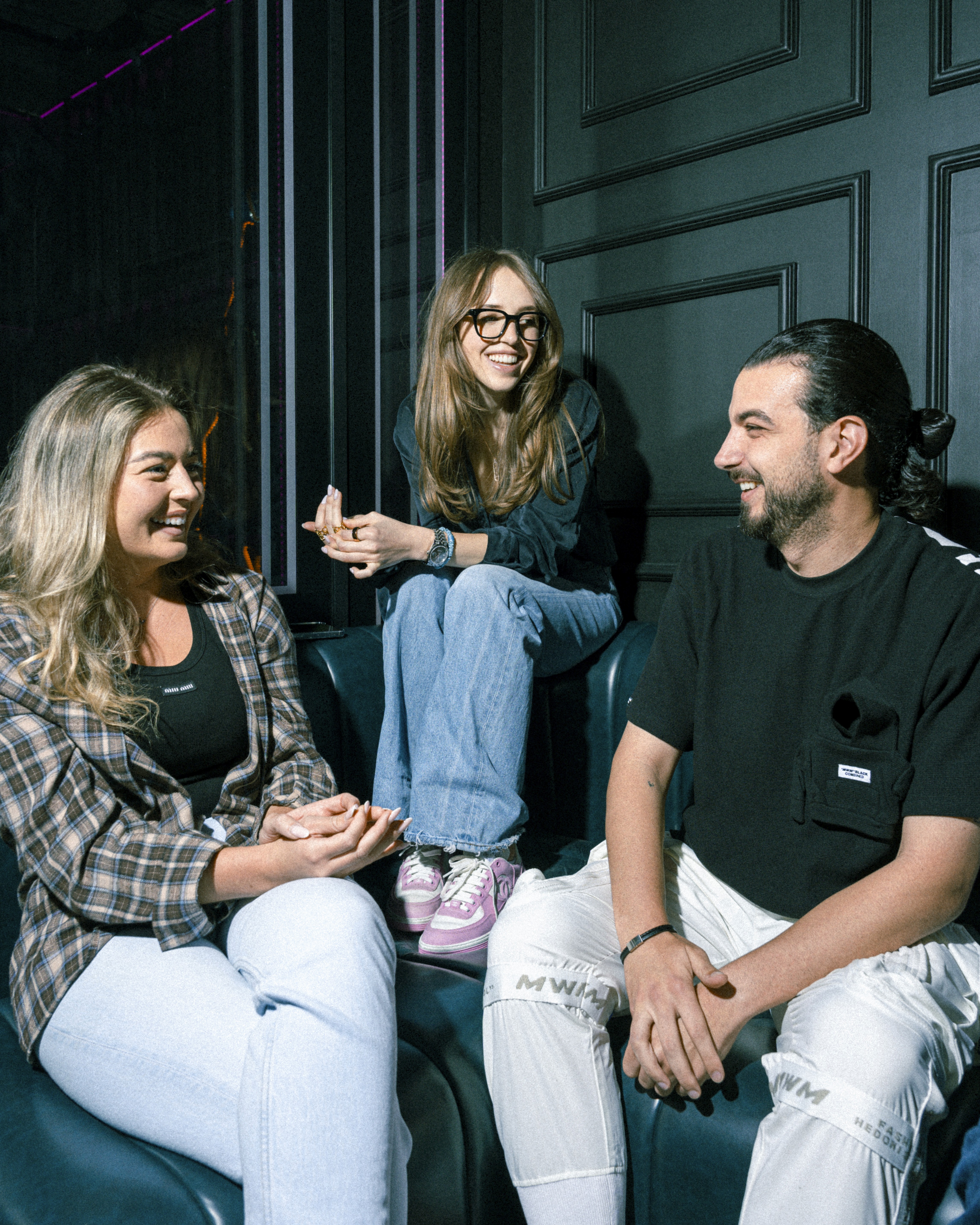 Friends laughing and gathering at Social Distrikt, at the best private party venues in Dubai Mall’s food hall in the Downtown area