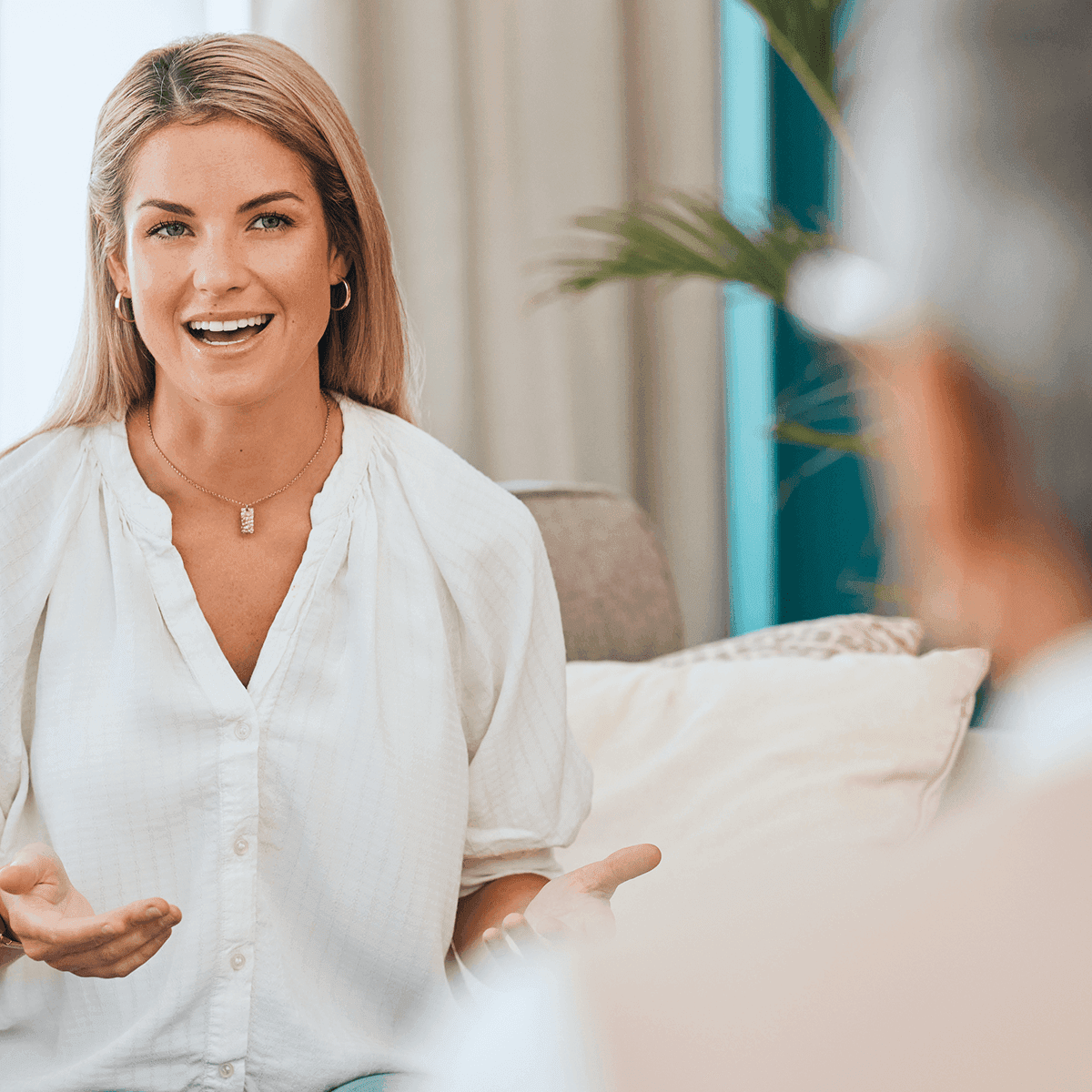 Smiling therapist speaking with patient