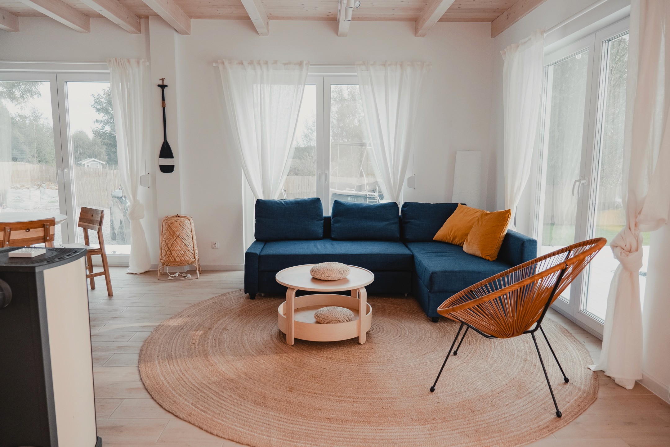 A serene garden-view hotel suite with private patio surrounded by tropical plants