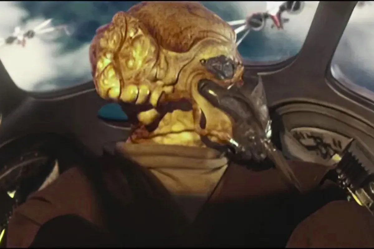 Jedi Master Plo Koon piloting his starfighter over Cato Neimoidia during Star Wars: Episode III – Revenge of the Sith. The Kel Dor Jedi is seen from behind as he glances toward incoming clone starfighters moments before being shot down during Order 66. The sky outside is filled with Republic ships turning against him.