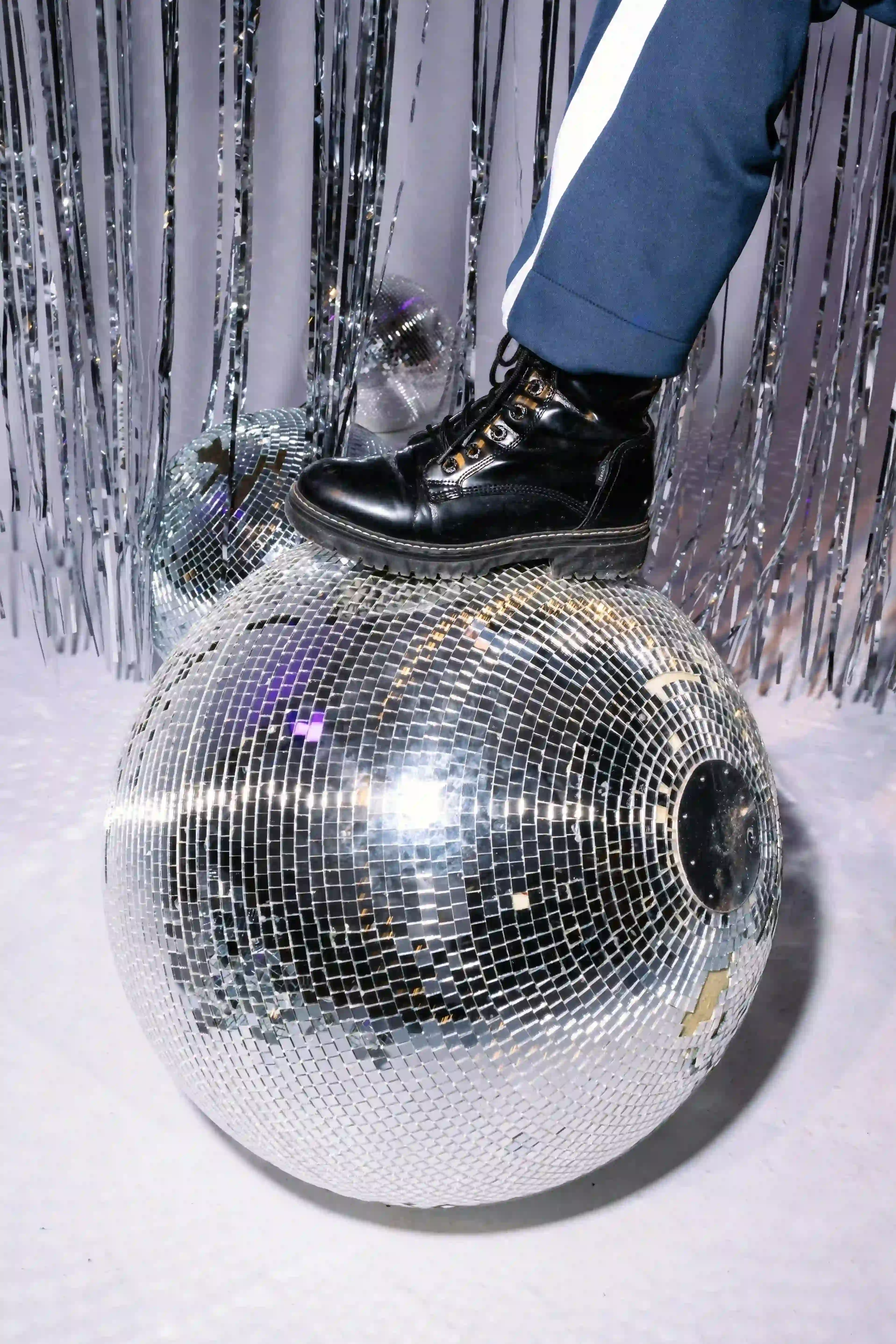 person holding red and black ball