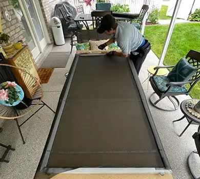 Window screen frame and spline on a workbench, showing our screen assembly process.