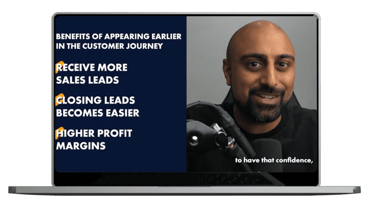 man-smiling-speaking-into-microphone-with-text-on-screen-listing-benefits-of-appearing-earlier-in-customer-journey