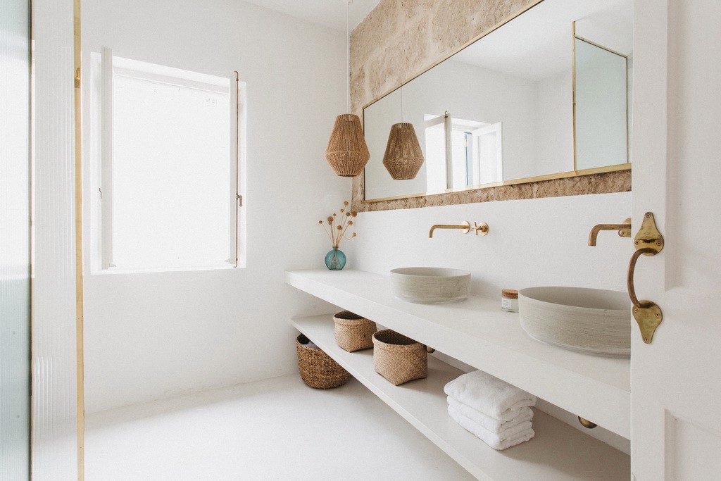 Double vanity with tadelakt countertops in white bathroom