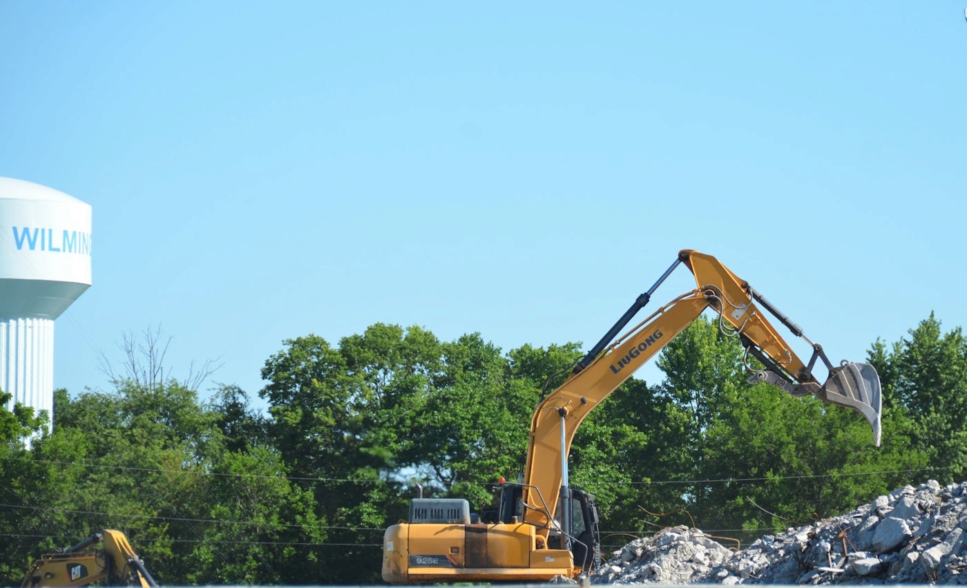 Yellow excavator working at a construction site
