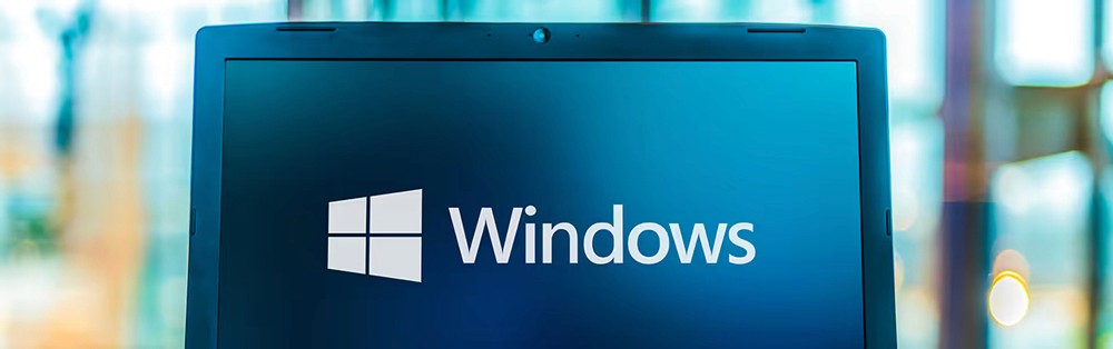 Red digital warning symbol glowing on a circuit board interface, representing active ransomware exploitation of the VMware ESXi CVE 2025 22225 vulnerability and hypervisor compromise.