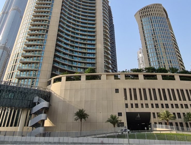 Podium and entrance view of Burj Vista. Secure your dream home in Dubai with our top-tier real estate services.