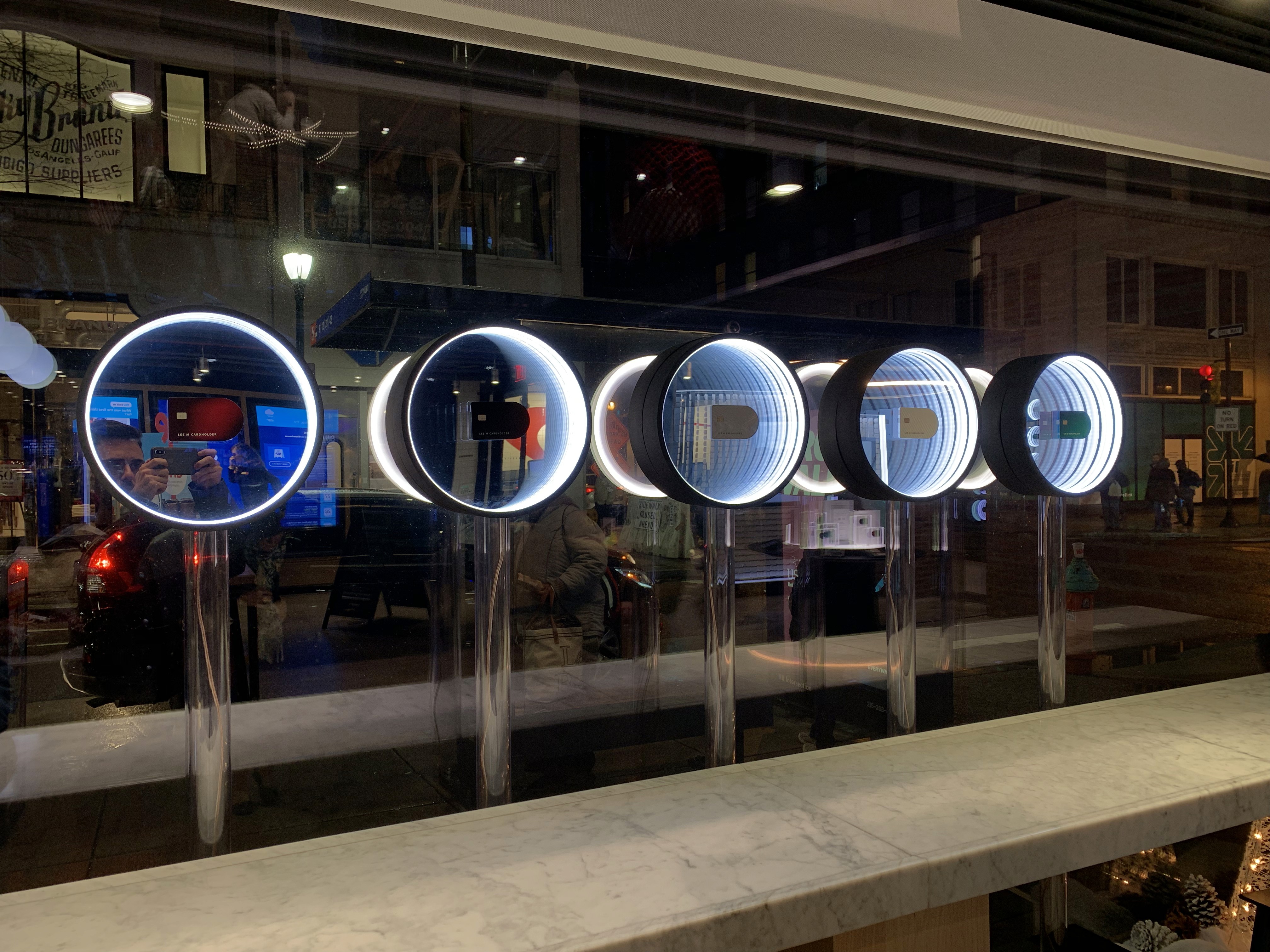 Picture of the infinity mirror displays in the window of the retial location.