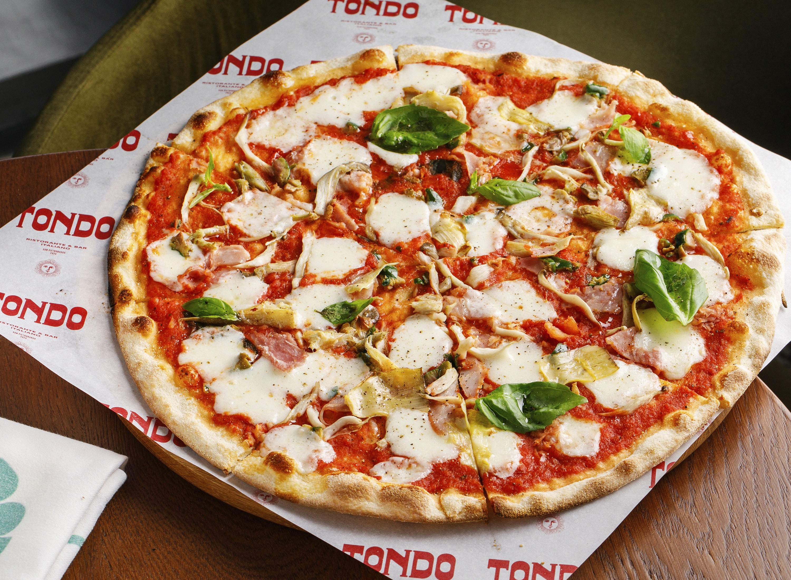 Streetside billboard with flyposters of the Batch.Works brand and illustrations