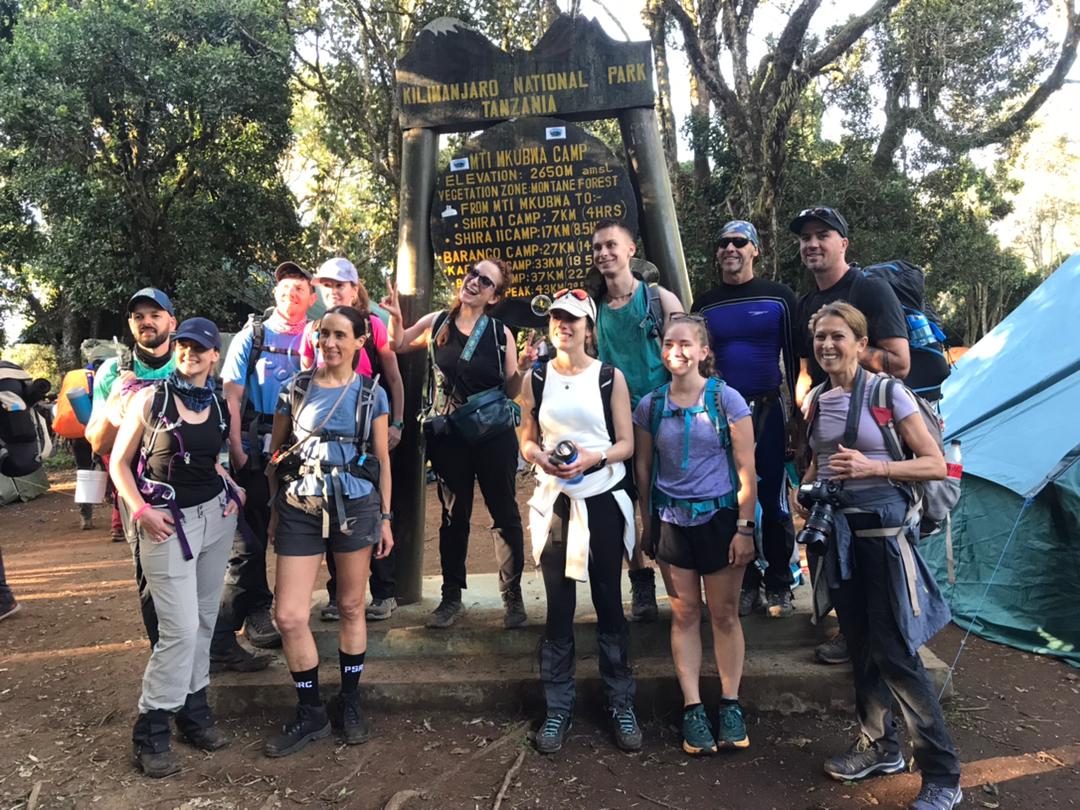 Traditional Arabic setup with chairs and lanterns in the desert sands of AlUla during sunrise.