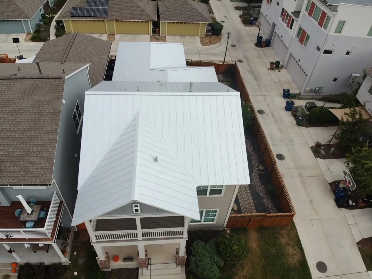 After - another angle: standing seam above a balcony.