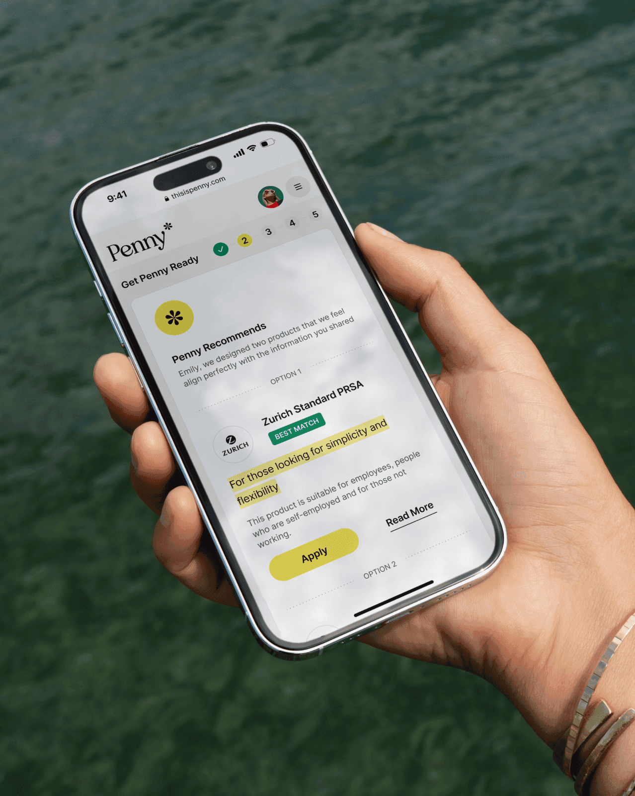 Hand holding a smartphone displaying the Penny app's recommendation for a Zurich Standard PRSA plan.
