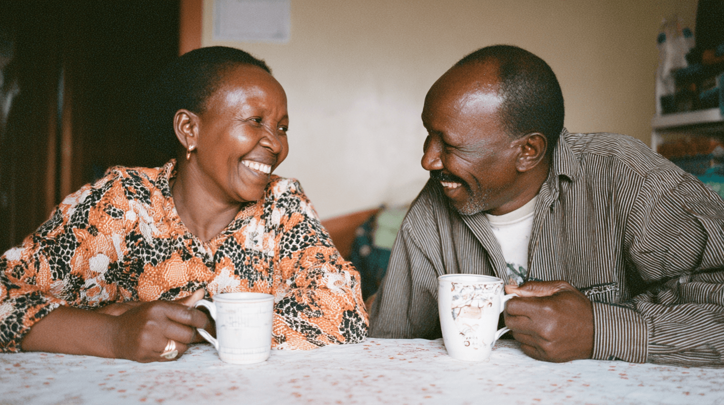 Person climbing a colorful outdoor bouldering wall.