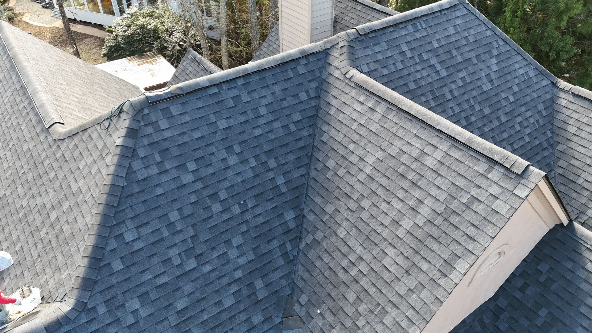 Close-up of the new roof details on a two-story brick home in Alpharetta, GA