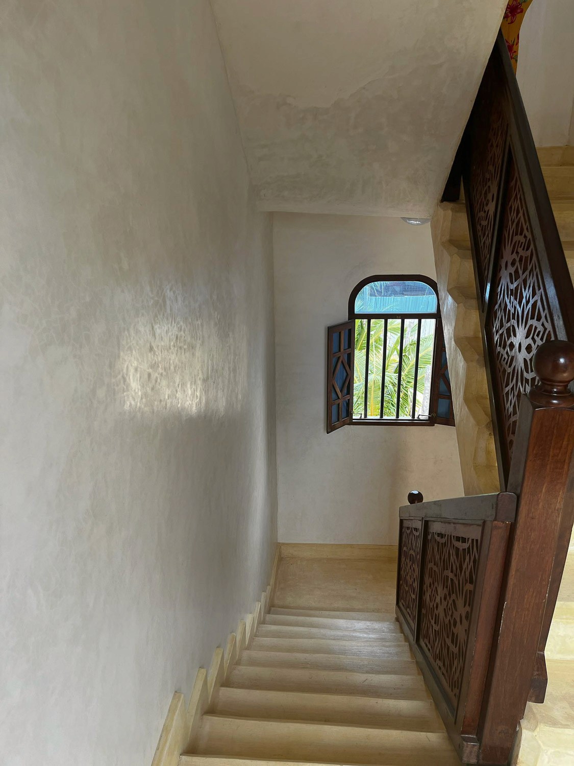Staircase with a window at the landing.