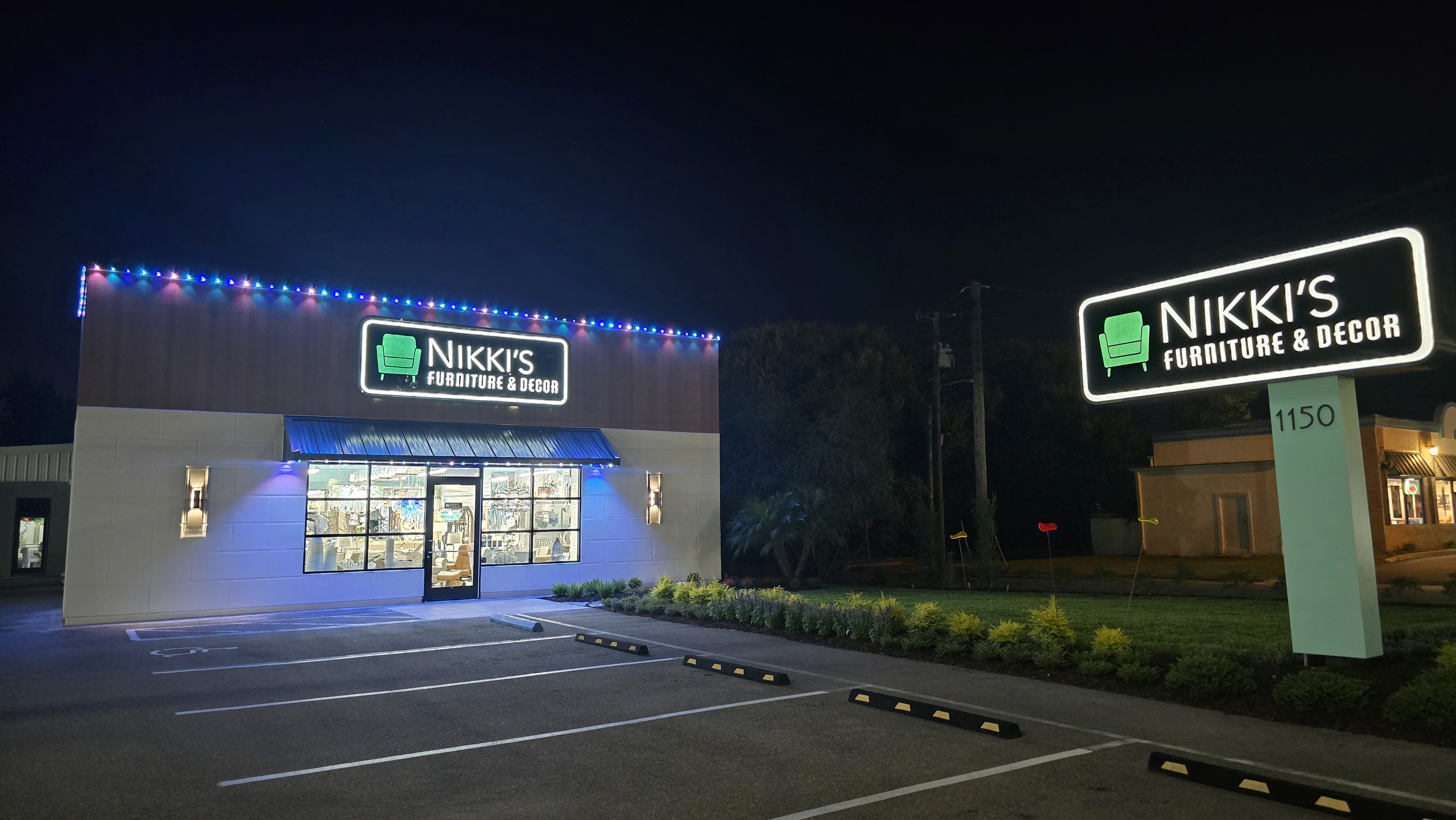 Retail storefront lighting installation with roofline and facade illumination