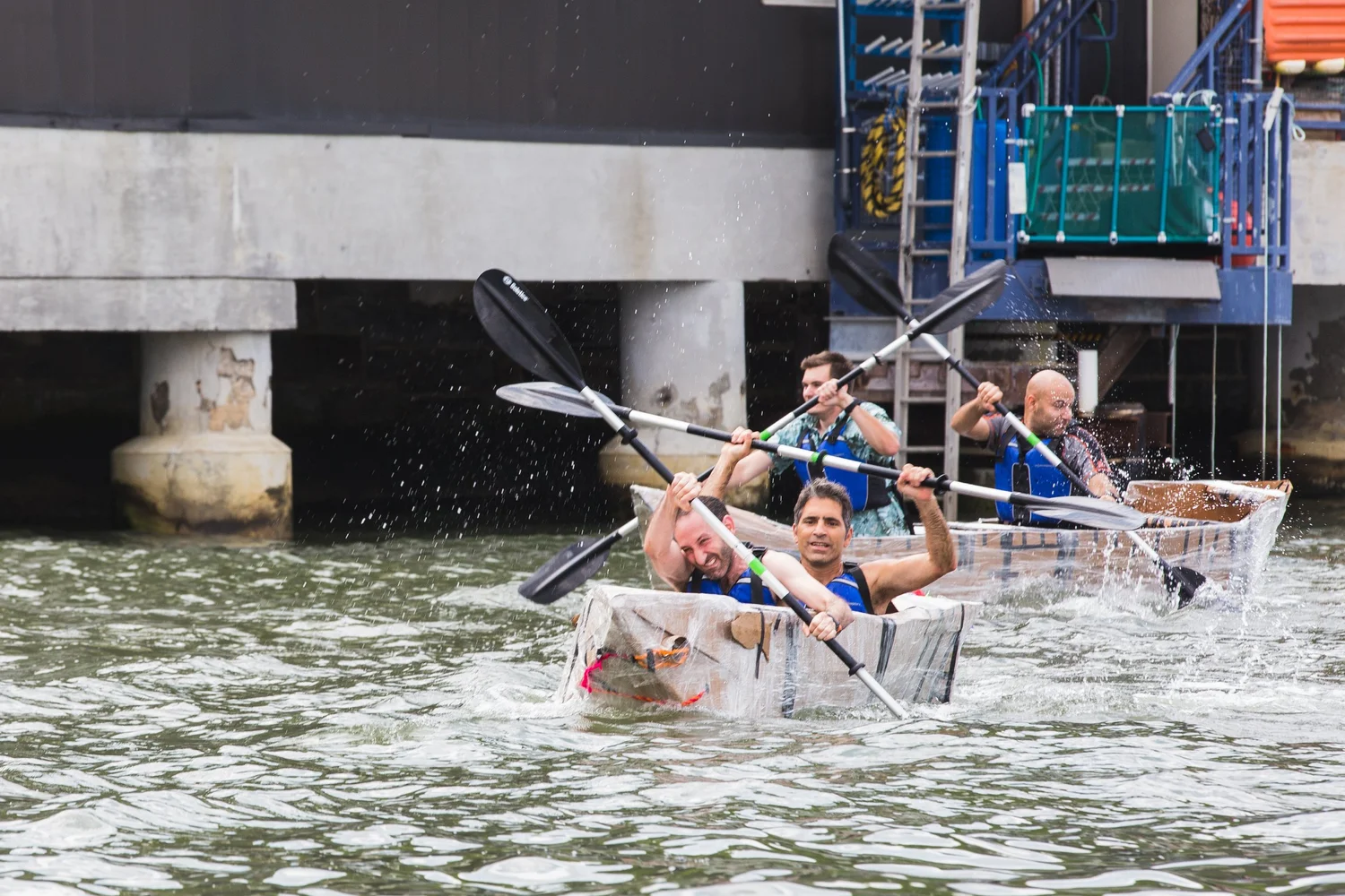 Image of people rowing a boat on the water