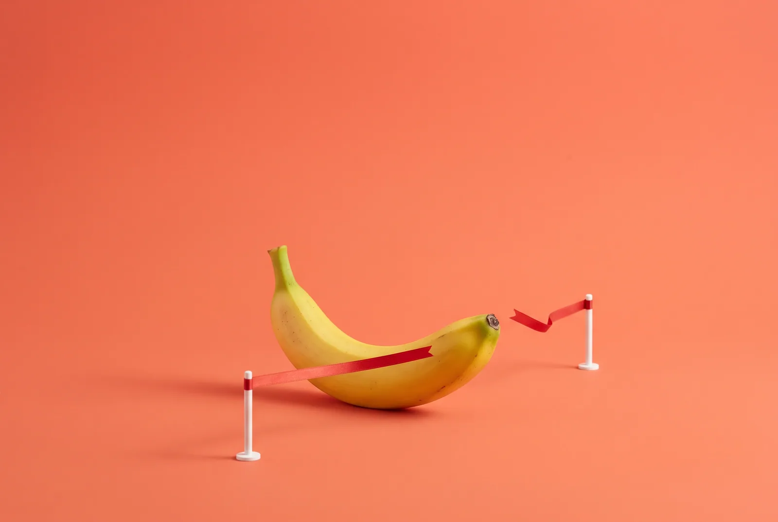 A banana breaking through a finish-line ribbon, switching from Relay to QUITTR