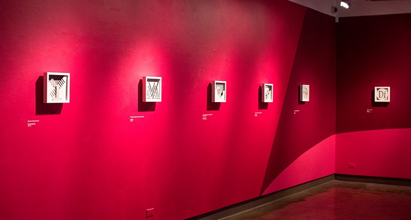 red wall with frames