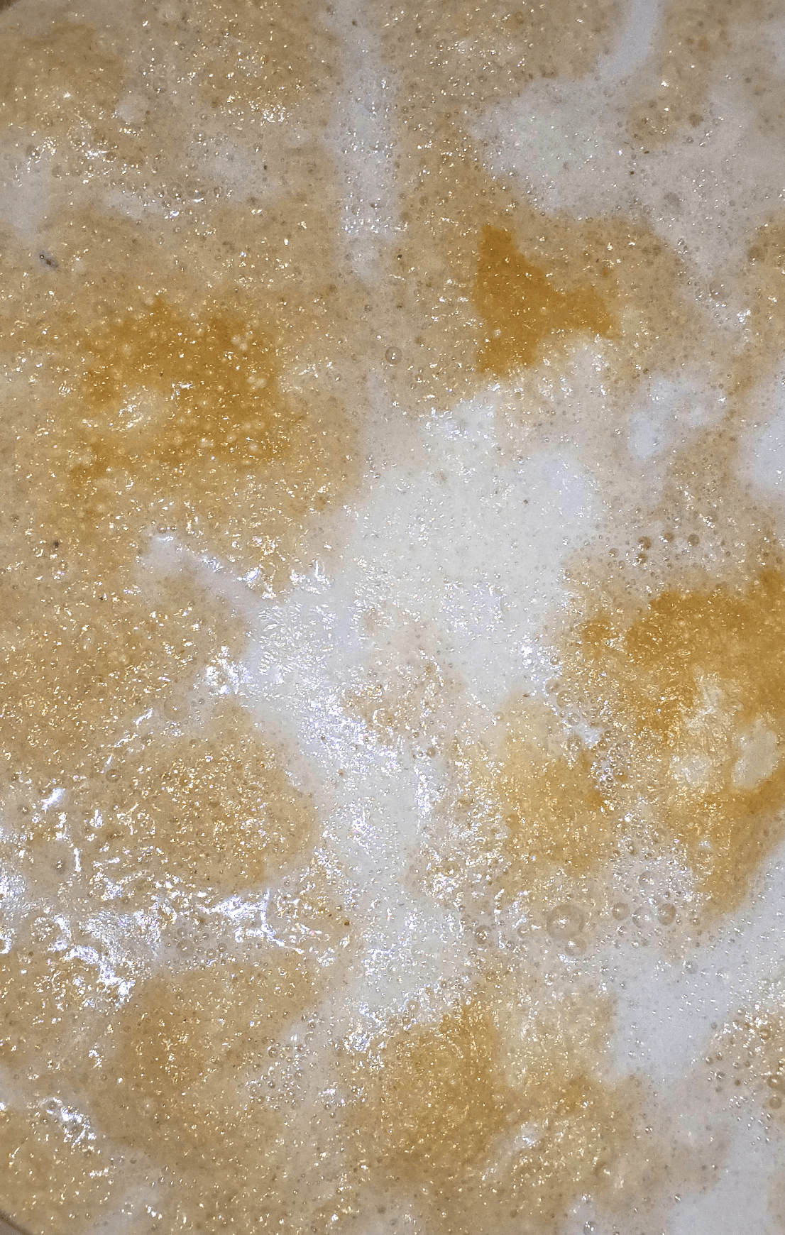 Butter rendering into golden ghee
