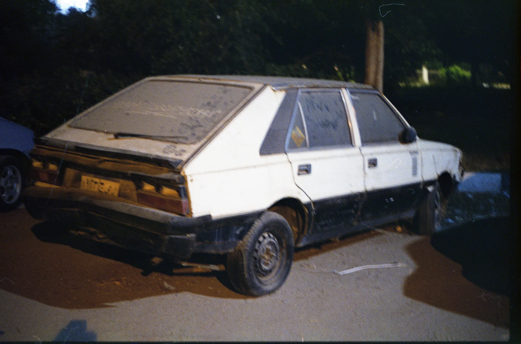 Dusty Hatchback After Dark