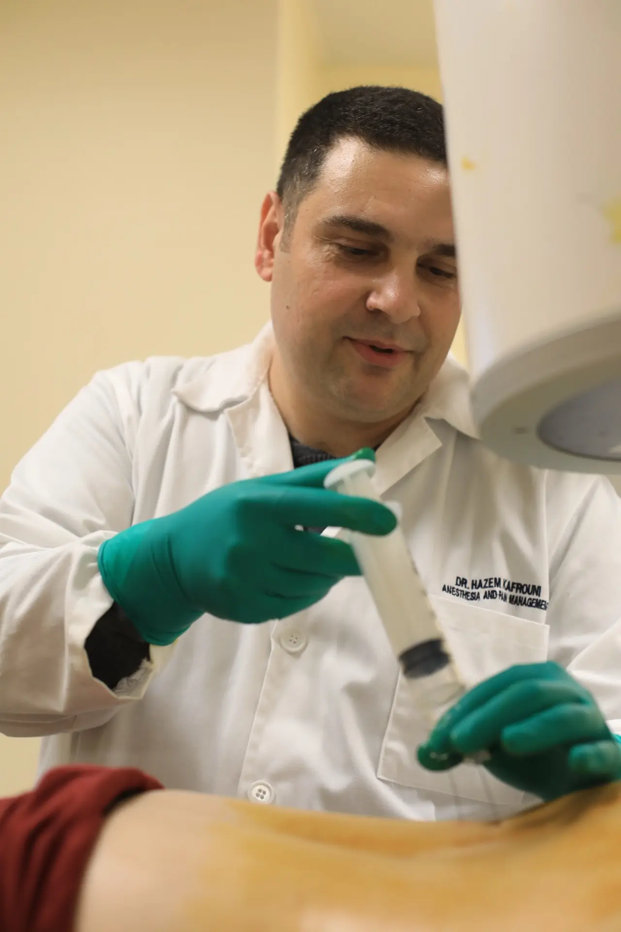 Dr. Hazem Kafrouni performing an image-guided pain management procedure in Beirut