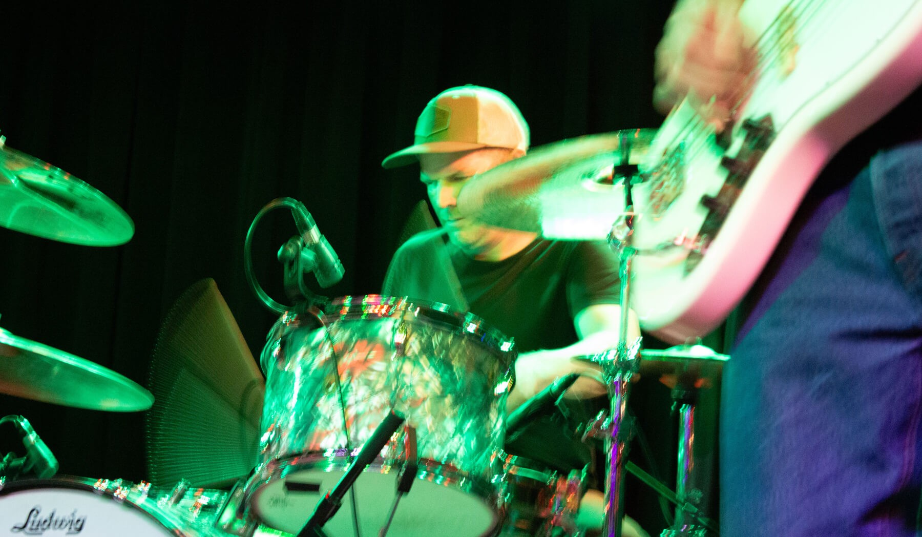 Holland Barry breaking a sweat on drums at Moe's Alley in Santa Cruz.
