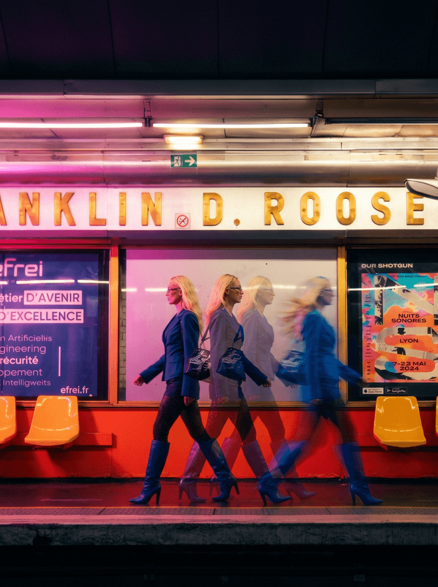 Tree branches against white house and fence