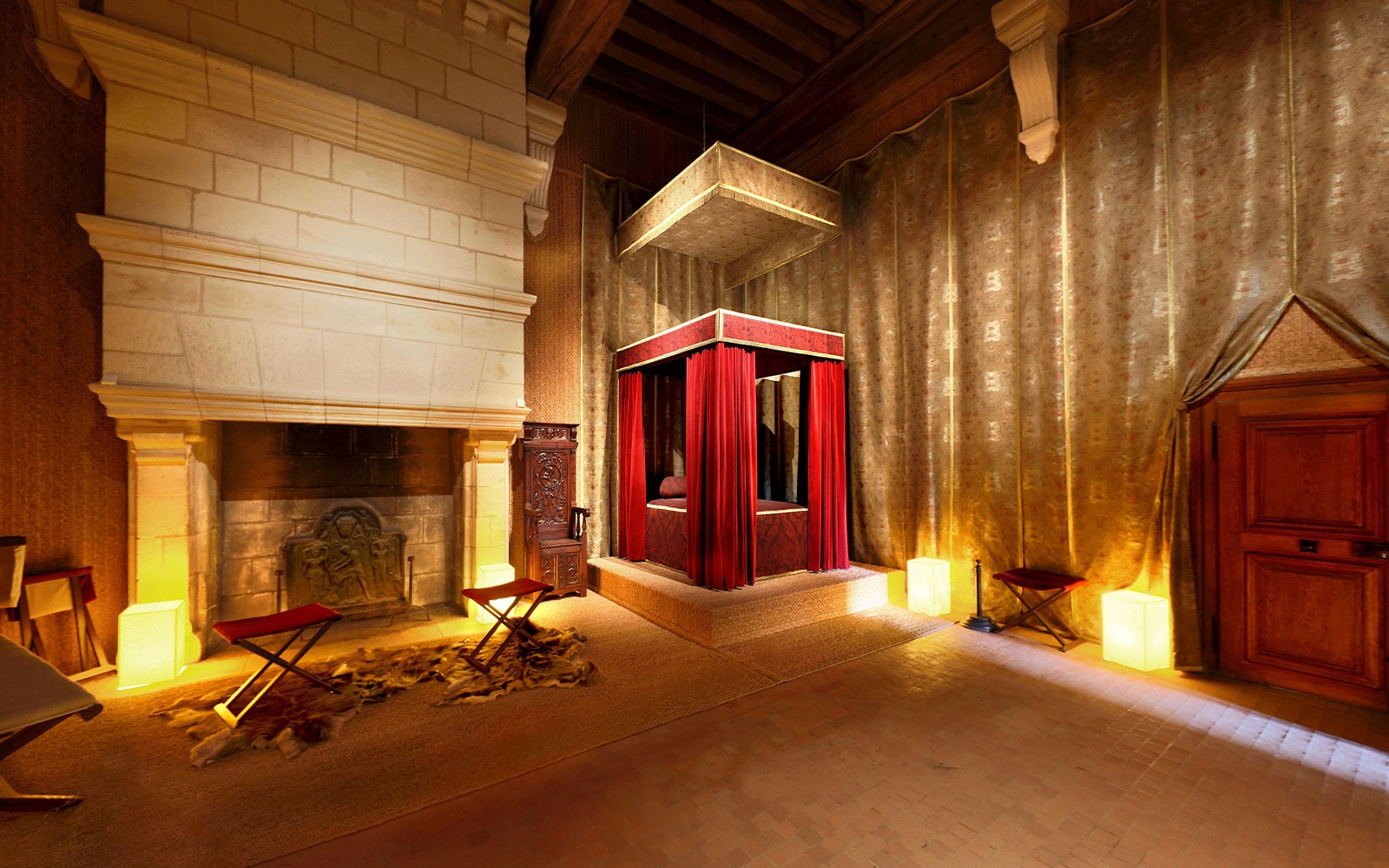 Bedroom of François I with canopy bed and fireplace at Château de Chambord, Loire Valley, France.