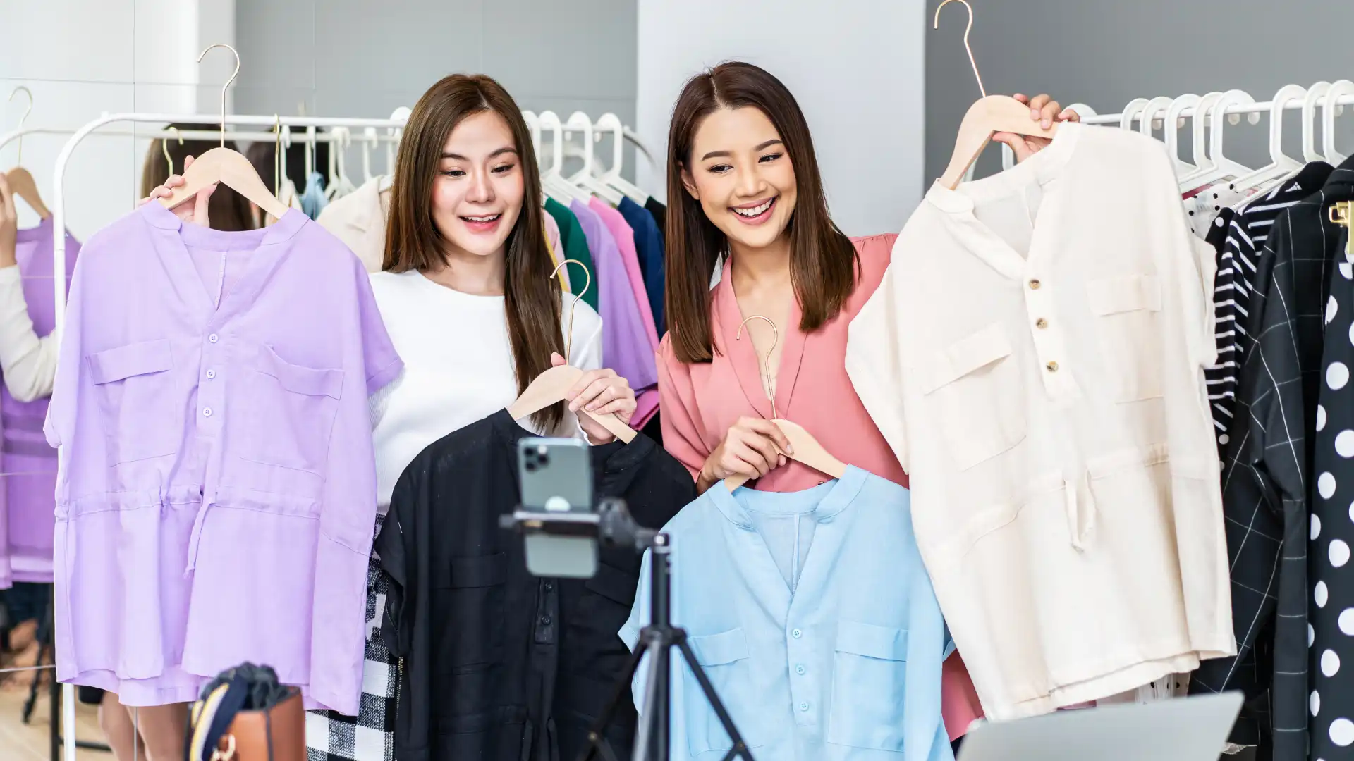 Fashion creators livestreaming clothes, demonstrating how TikTok Shop influencers are the new generation of QVC hosts.