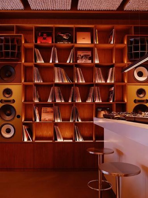 A record wall above a bar