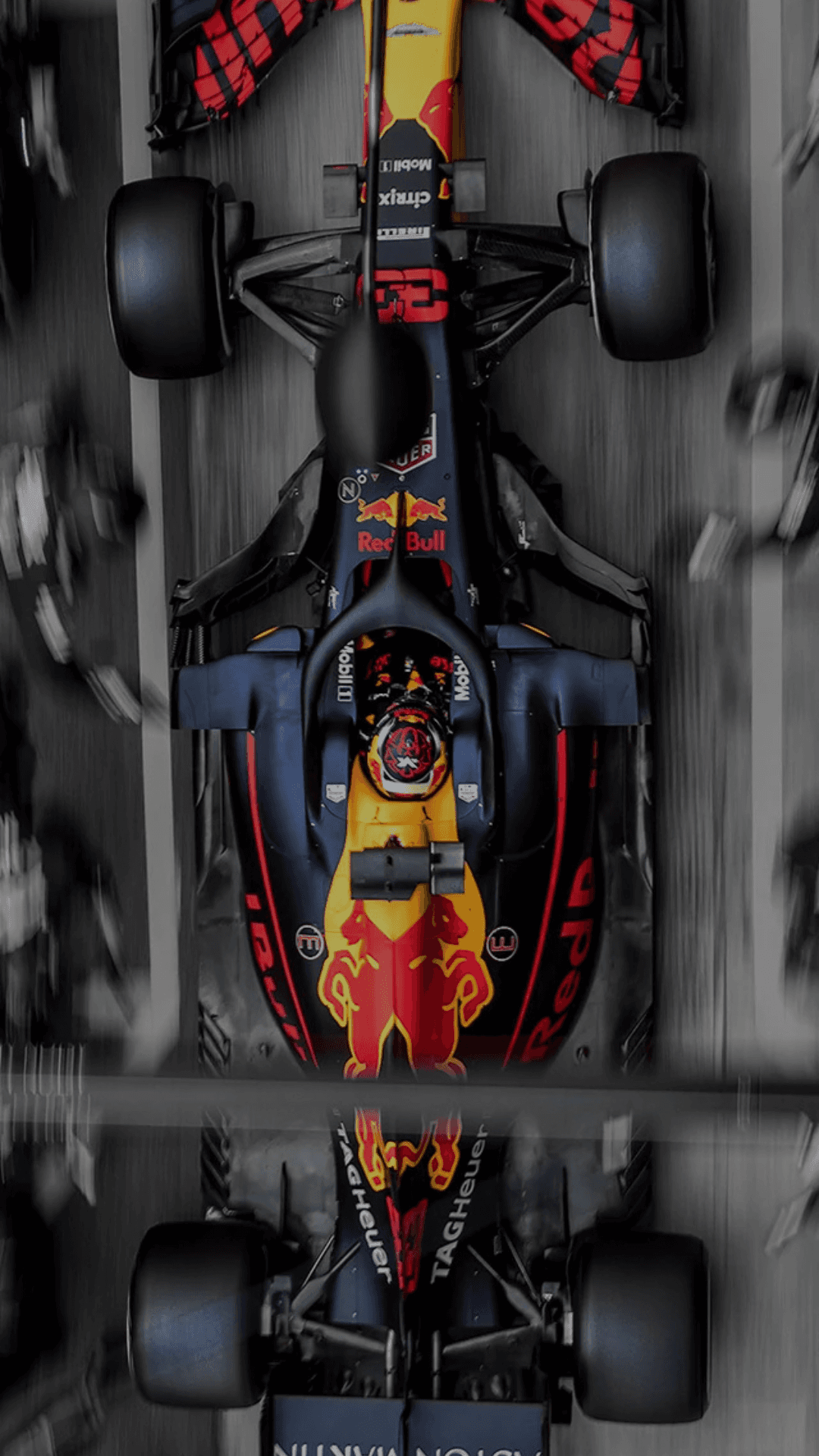 two people sitting on a bench looking at a mountain