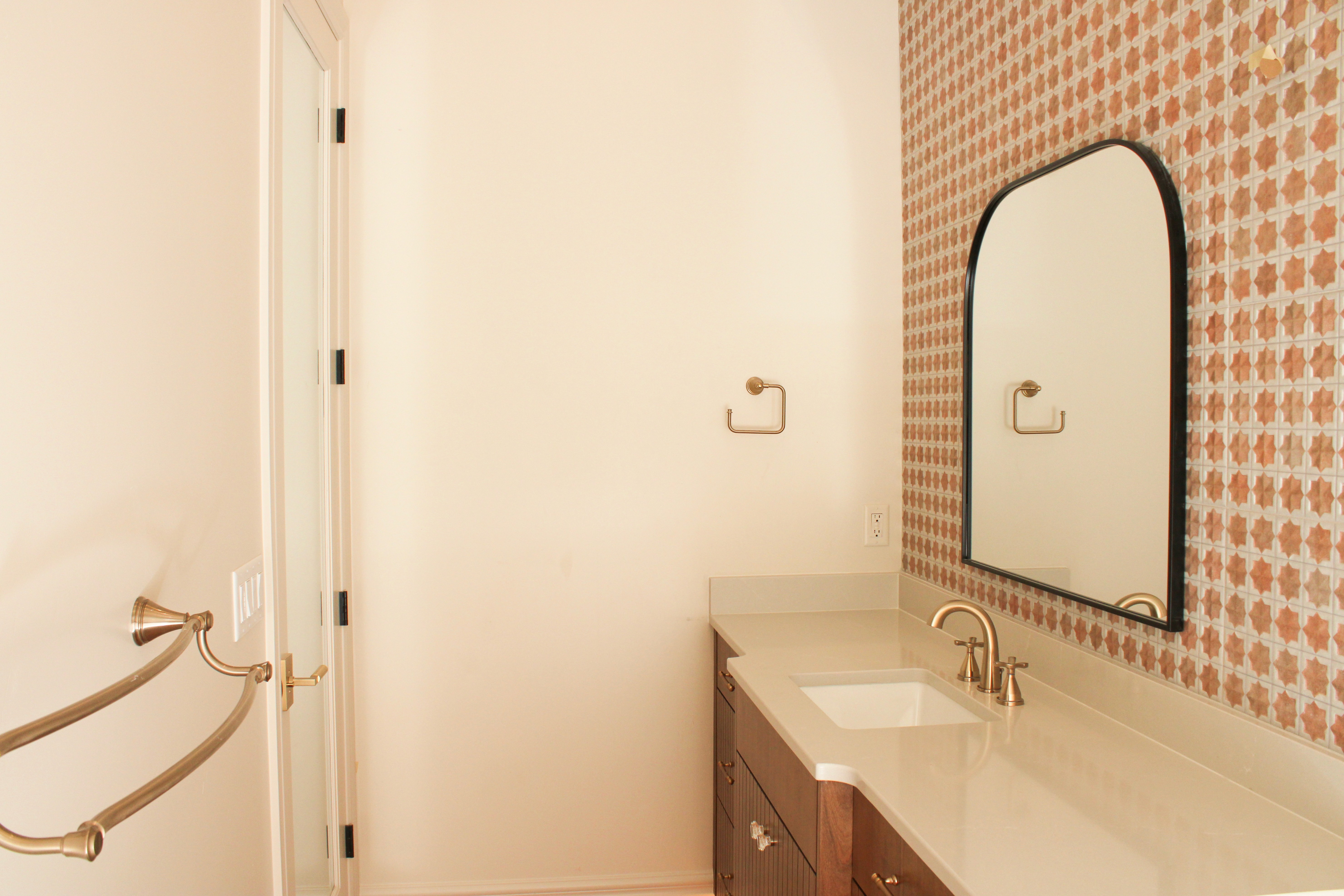 Bathroom with unique tile, arched accents in a modern St. George, Utah residence.