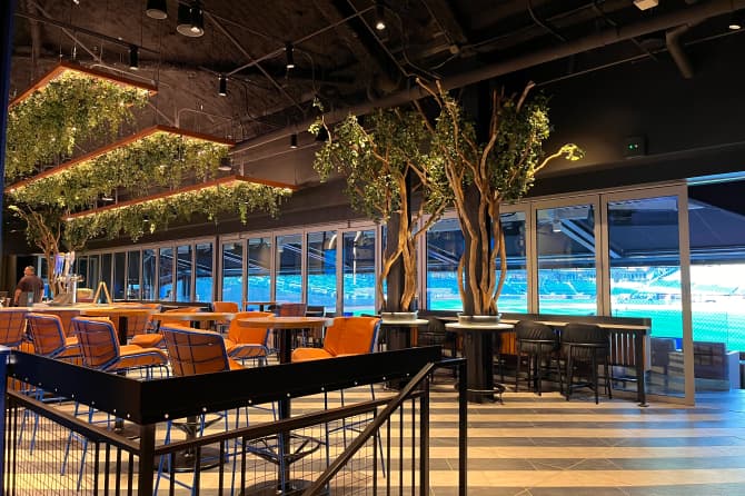 A shot of a long dining table in the swanky bar