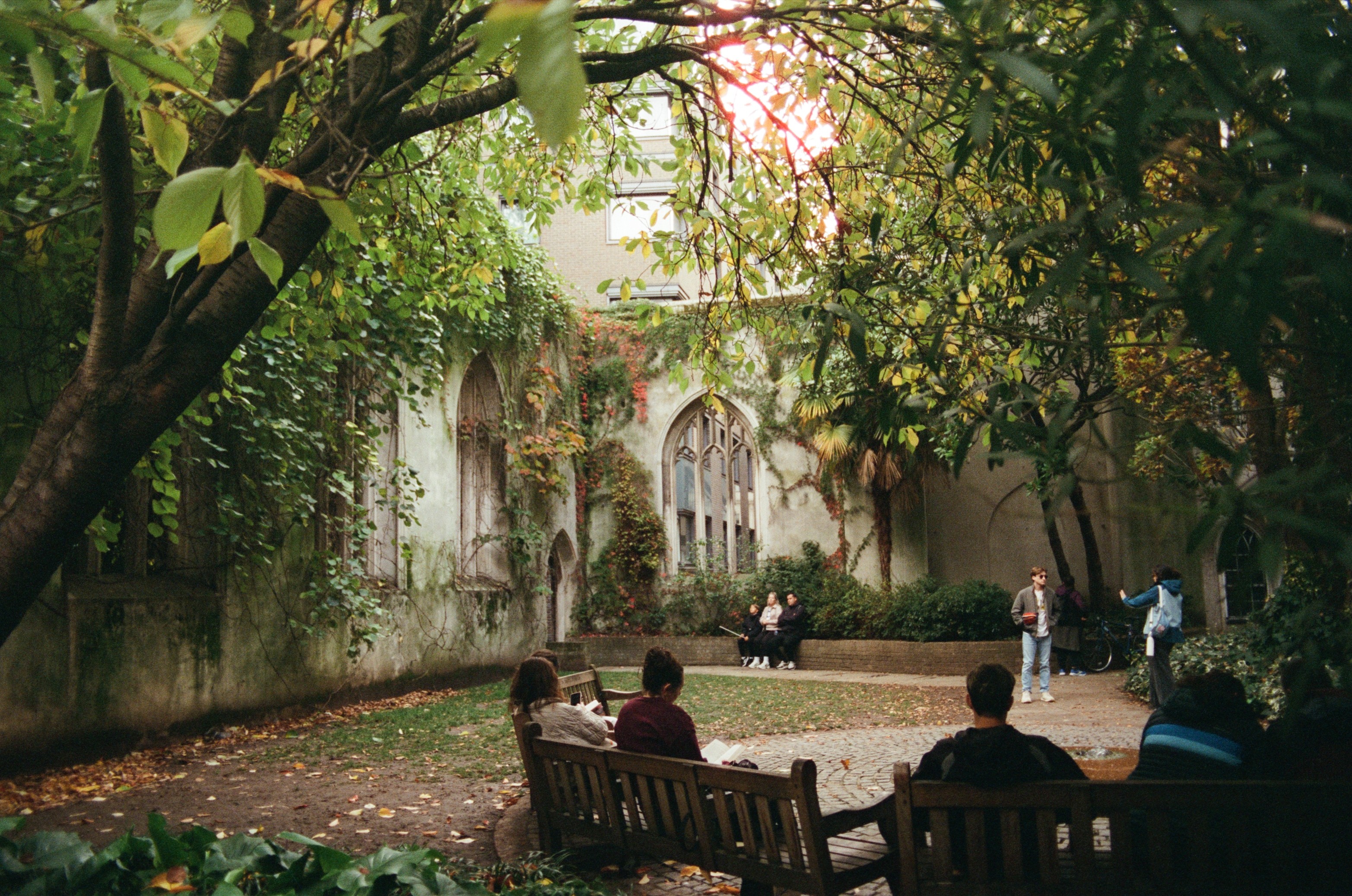 Modern skyscrapers line a busy highway in a sprawling city.
