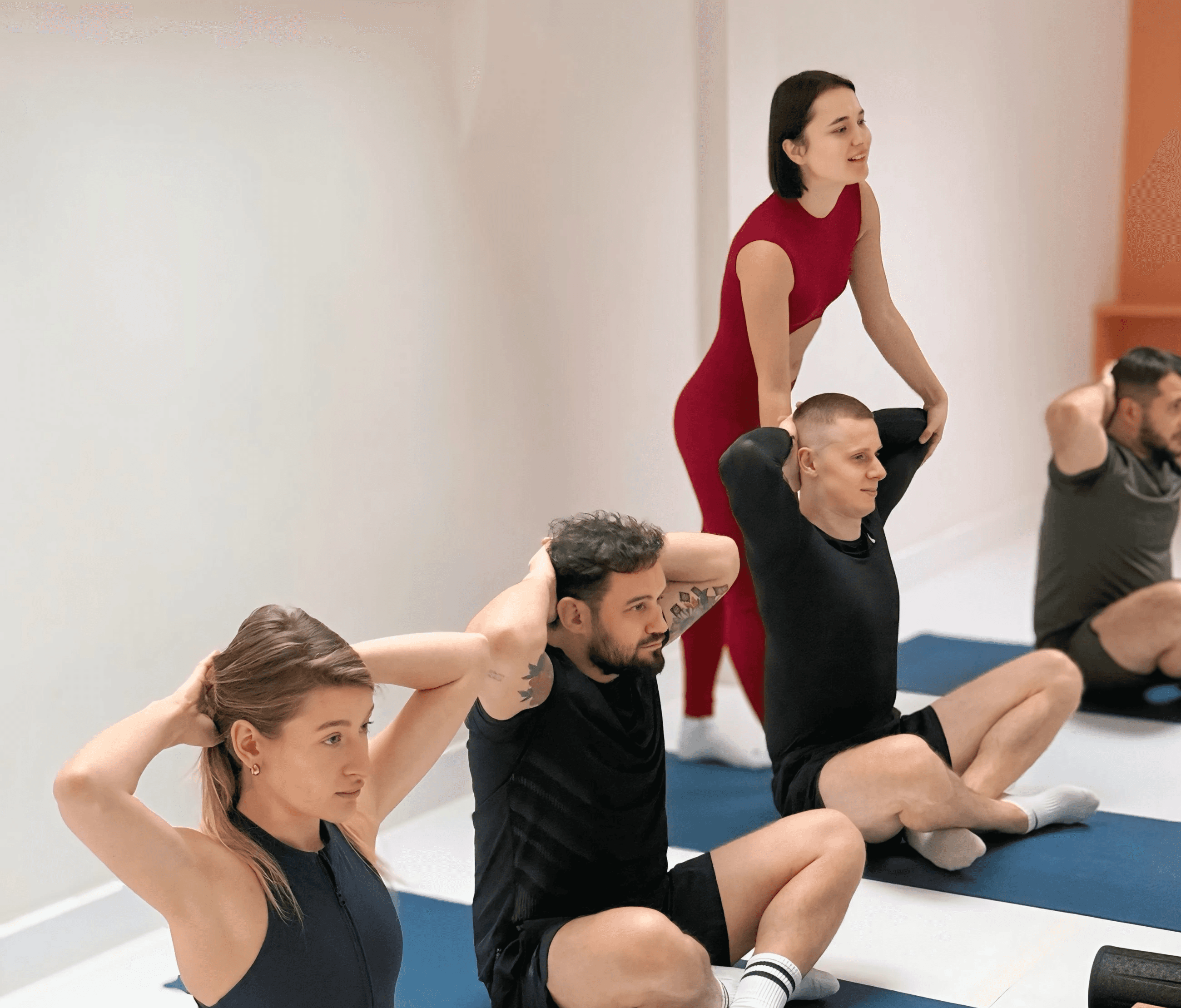 Aerial view of a winding road cutting through rocky terrain and sandy landscape.