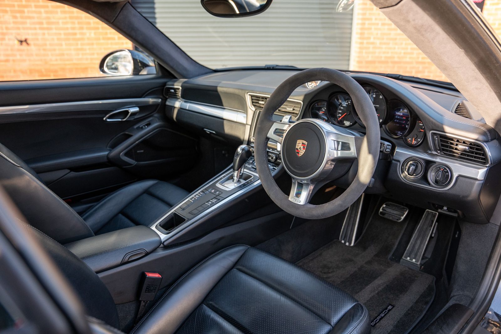 black porsche steering wheel