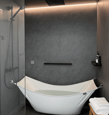 Beautiful woman smiling at the camera with a plain background