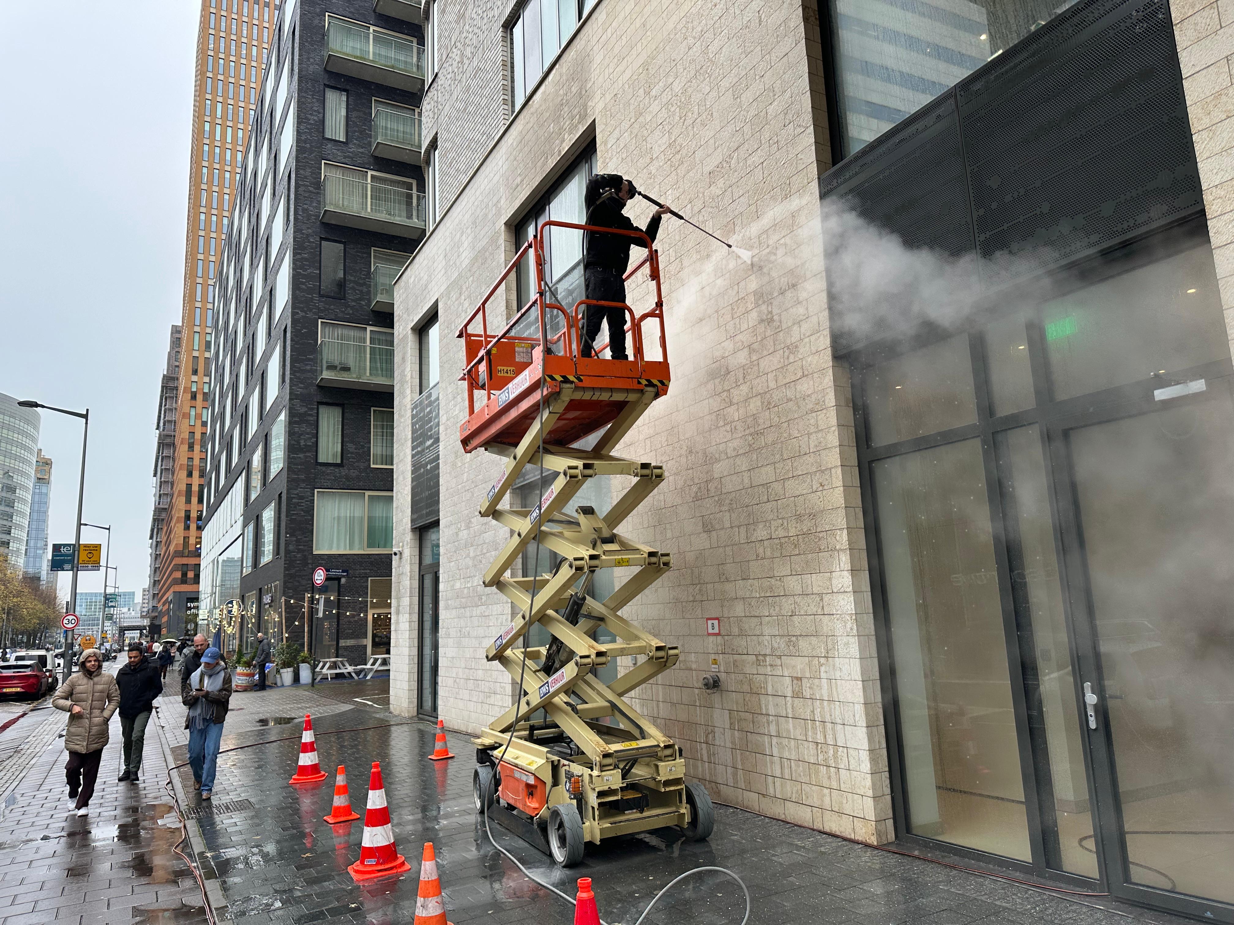 man in black crew neck t-shirt and blue shorts holding woman in white and red
