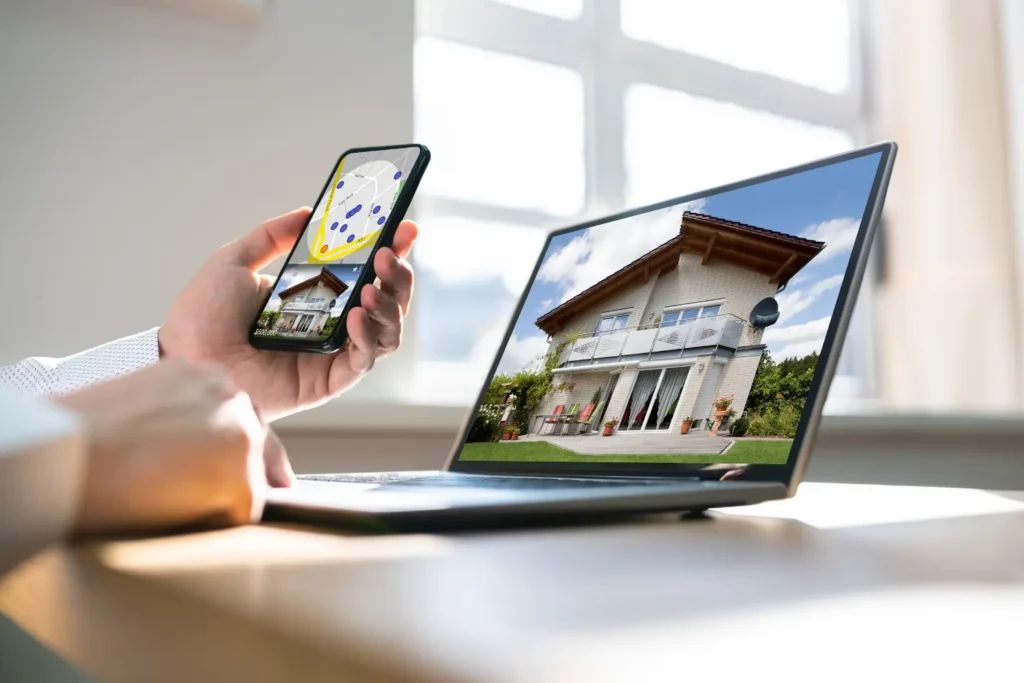 Best accounting software for property management displayed on phone and laptop with house image and map interface.