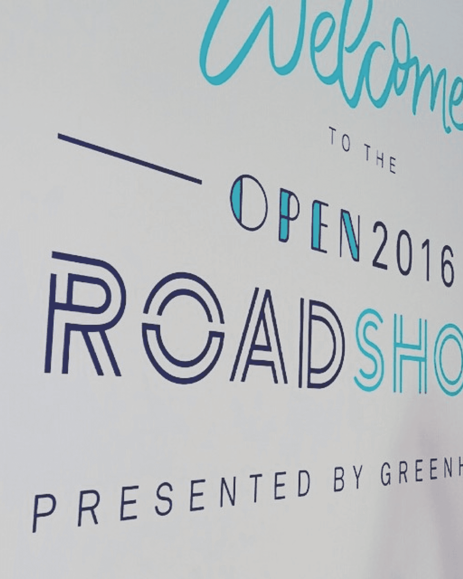 Bold wall lettering welcomes guests to the OPEN Roadshow, showing how the new event identity extended beyond the flagship conference.
