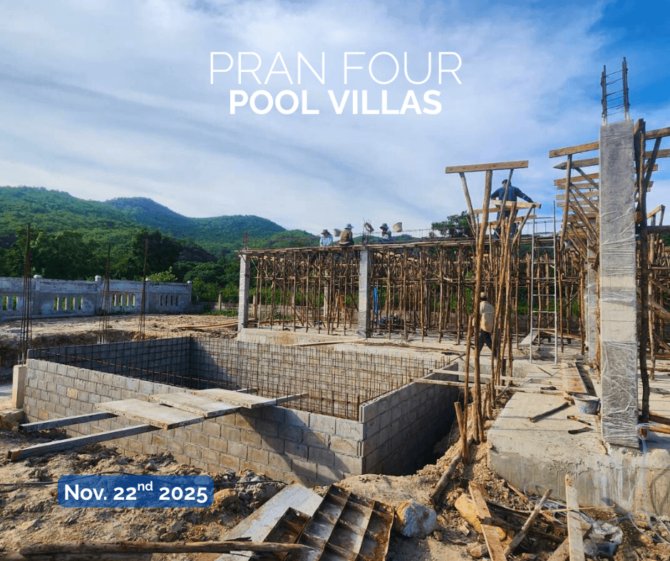 Structure rising with mountain backdrop