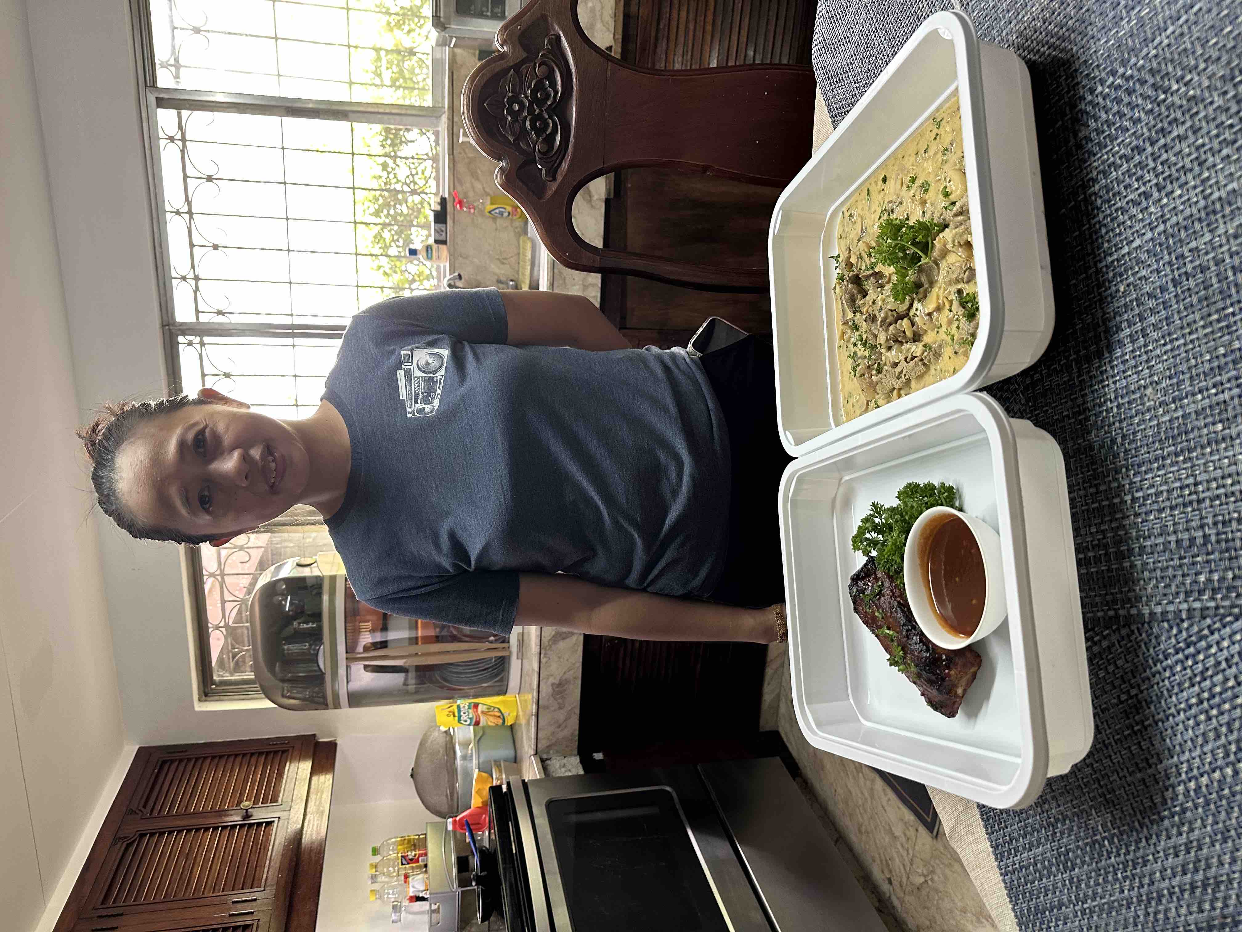 man in green crew neck shirt and black hat