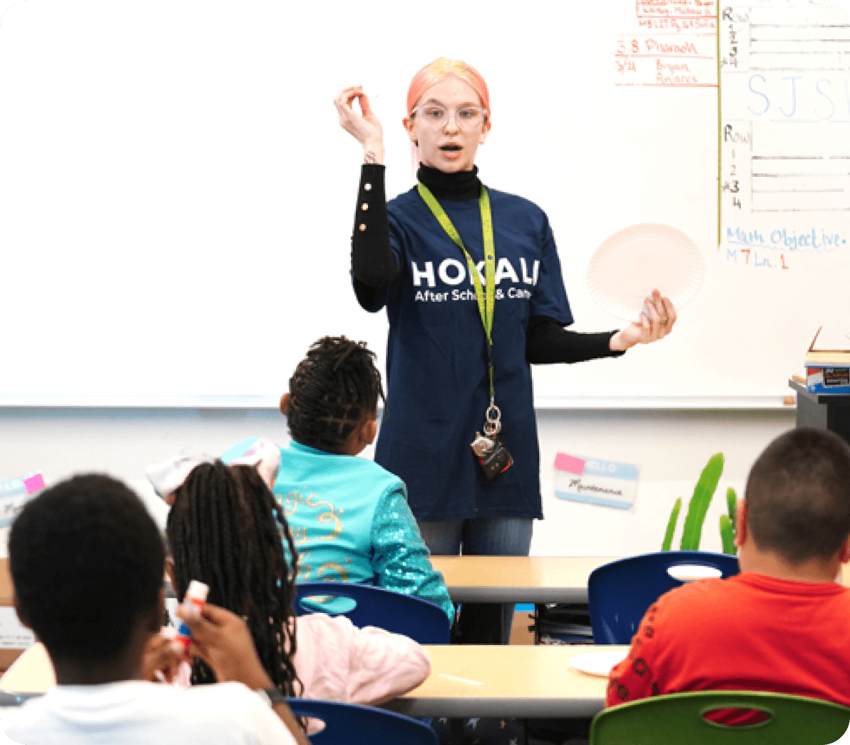 HOKALI educators guiding students through active play and teamwork during an outdoor enrichment session