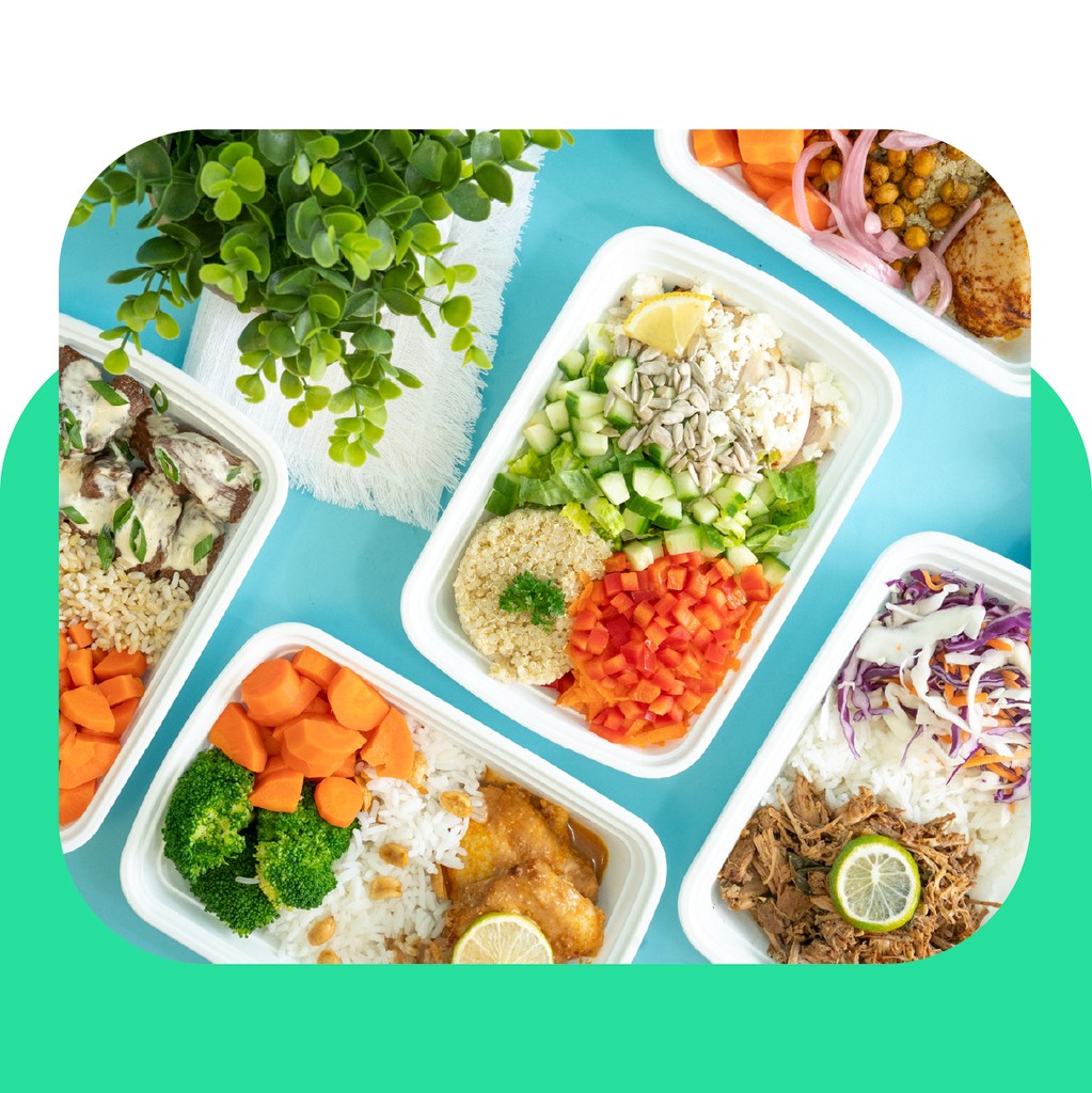 Top down image of tabel filled with a variety of different meals